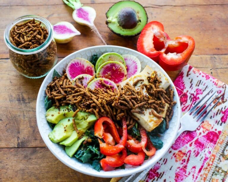 Vegan Kale Tofu Bowl Topped With Turmeric Hemp Hearts